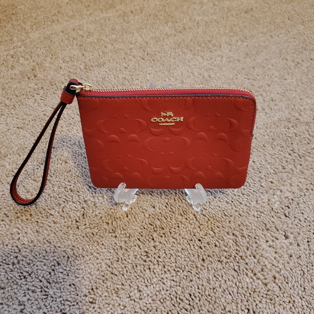 NWOT Coach wristlet with embossing